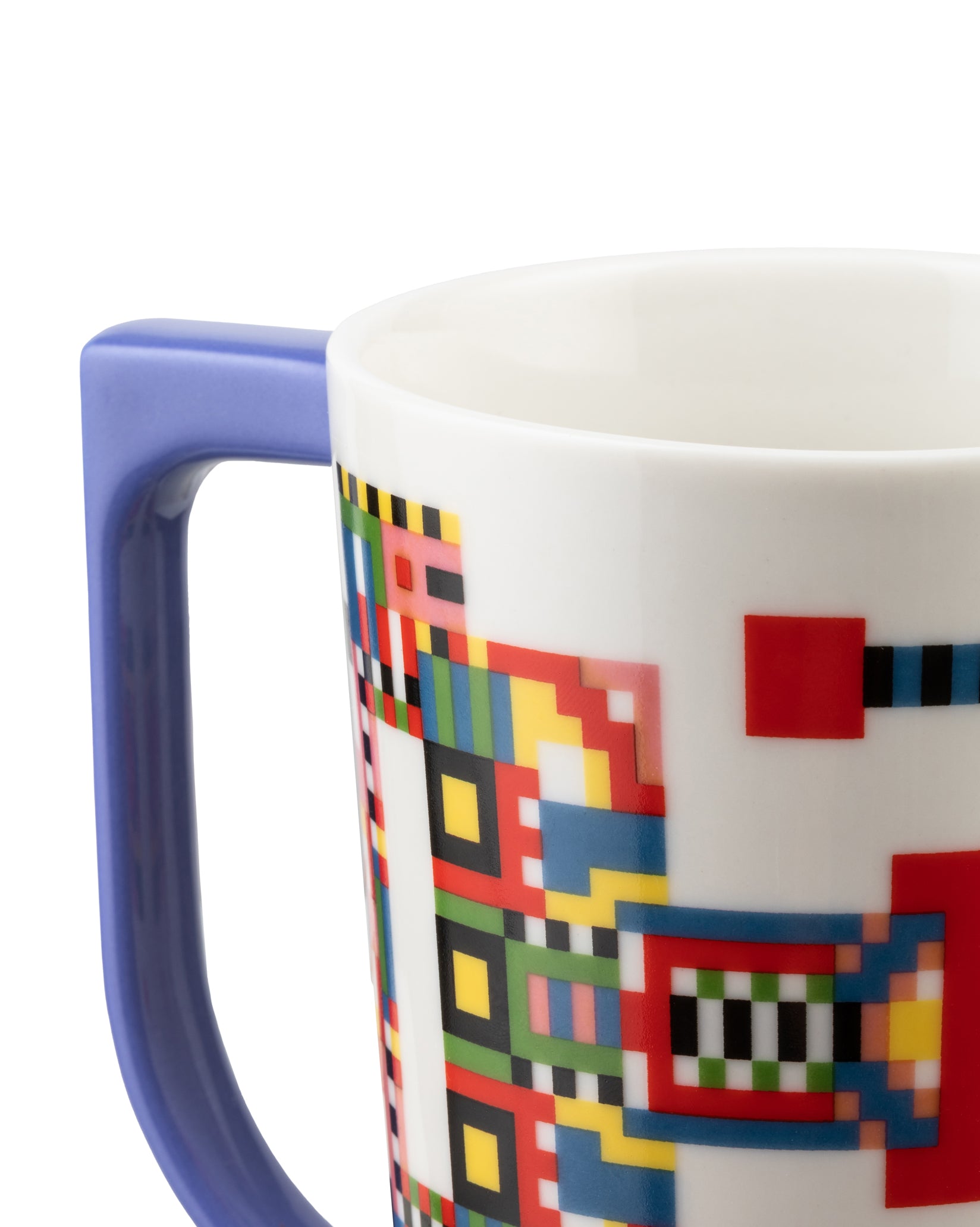 White mug by Alessi with a purple handle and a colorful pixelated geometric pattern, cropped view.