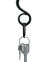 Black S-shaped key holder by Alessi, holding two silver keys on a metal ring, secured by a black fastener.
