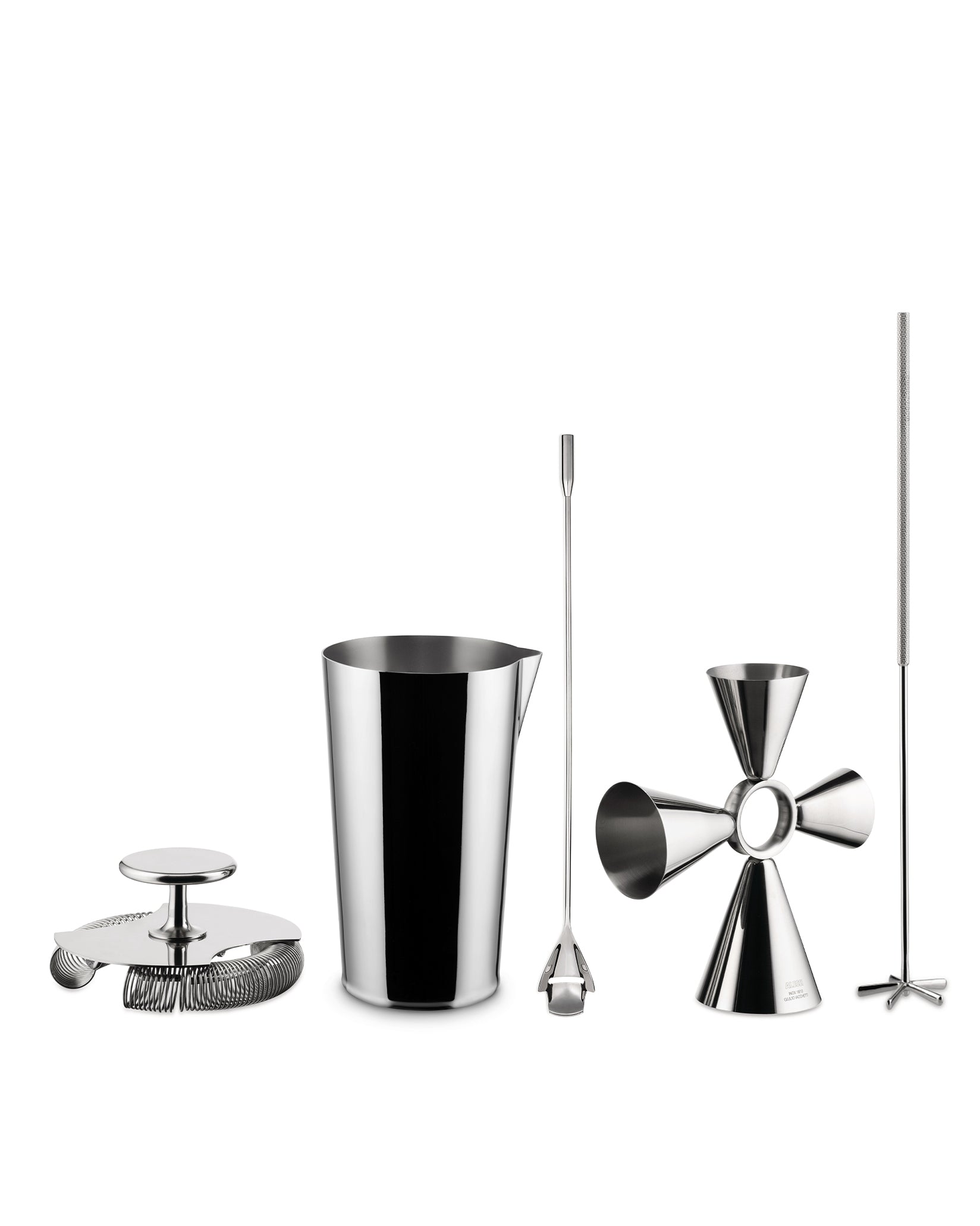 Silver stainless steel cocktail tool set by Alessi, featuring a shaker, strainer, bar spoon, jigger, and muddler on white.