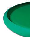 Emerald green bowl by Alessi with a smooth, subtly textured finish and curved rim.