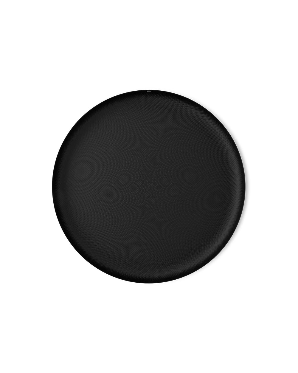 Round black textured platter by Alessi with a subtle dimpled pattern and small top edge notch.