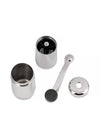Disassembled stainless steel coffee grinder by Alessi showing its two cylindrical parts, handle with black knob, and cap.