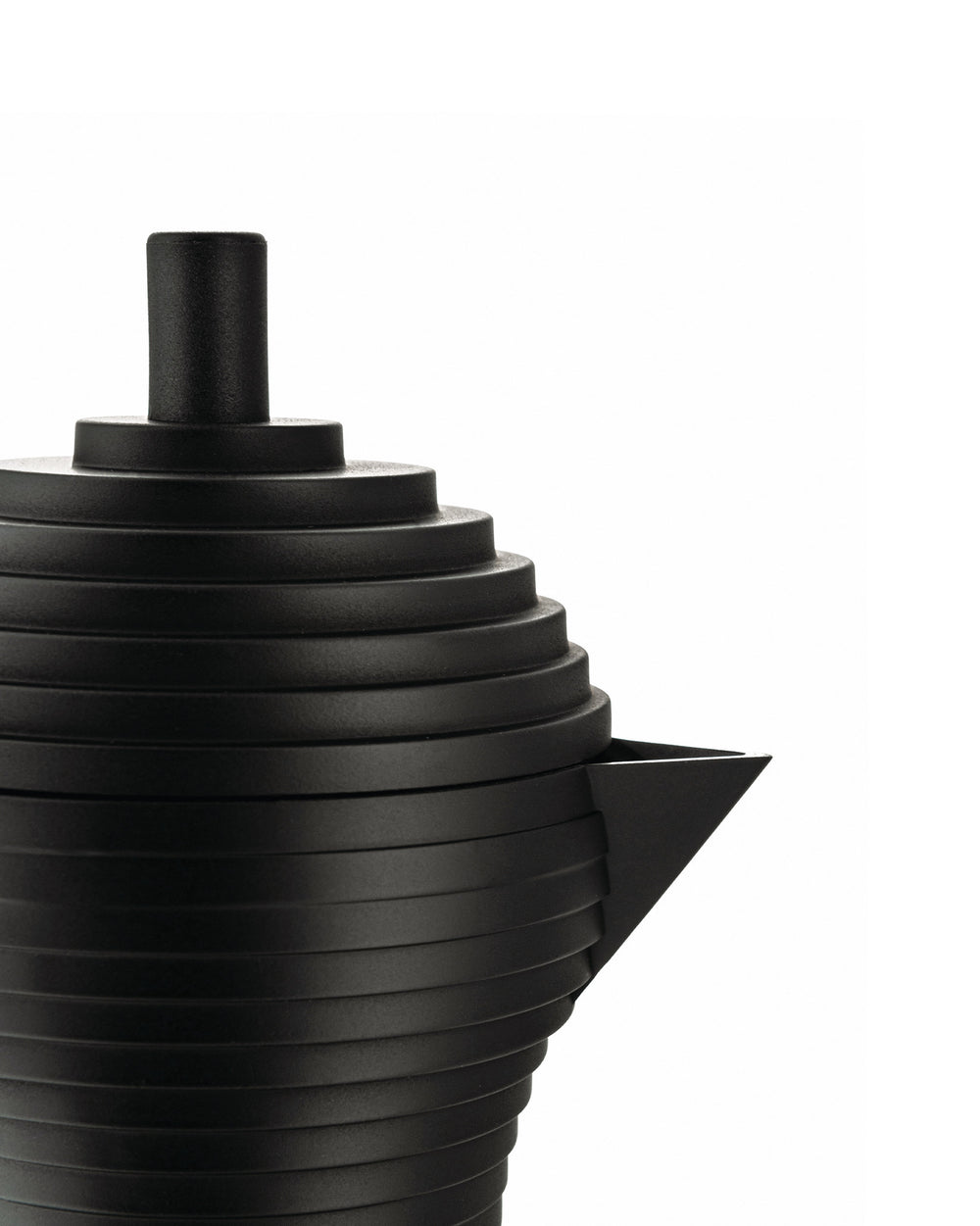 Matte black ribbed coffee maker by Alessi with a triangular spout and cylindrical top, cropped.