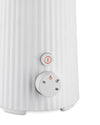 White ribbed electric beverage frother by Alessi, with a power button and selection dial featuring beverage icons.