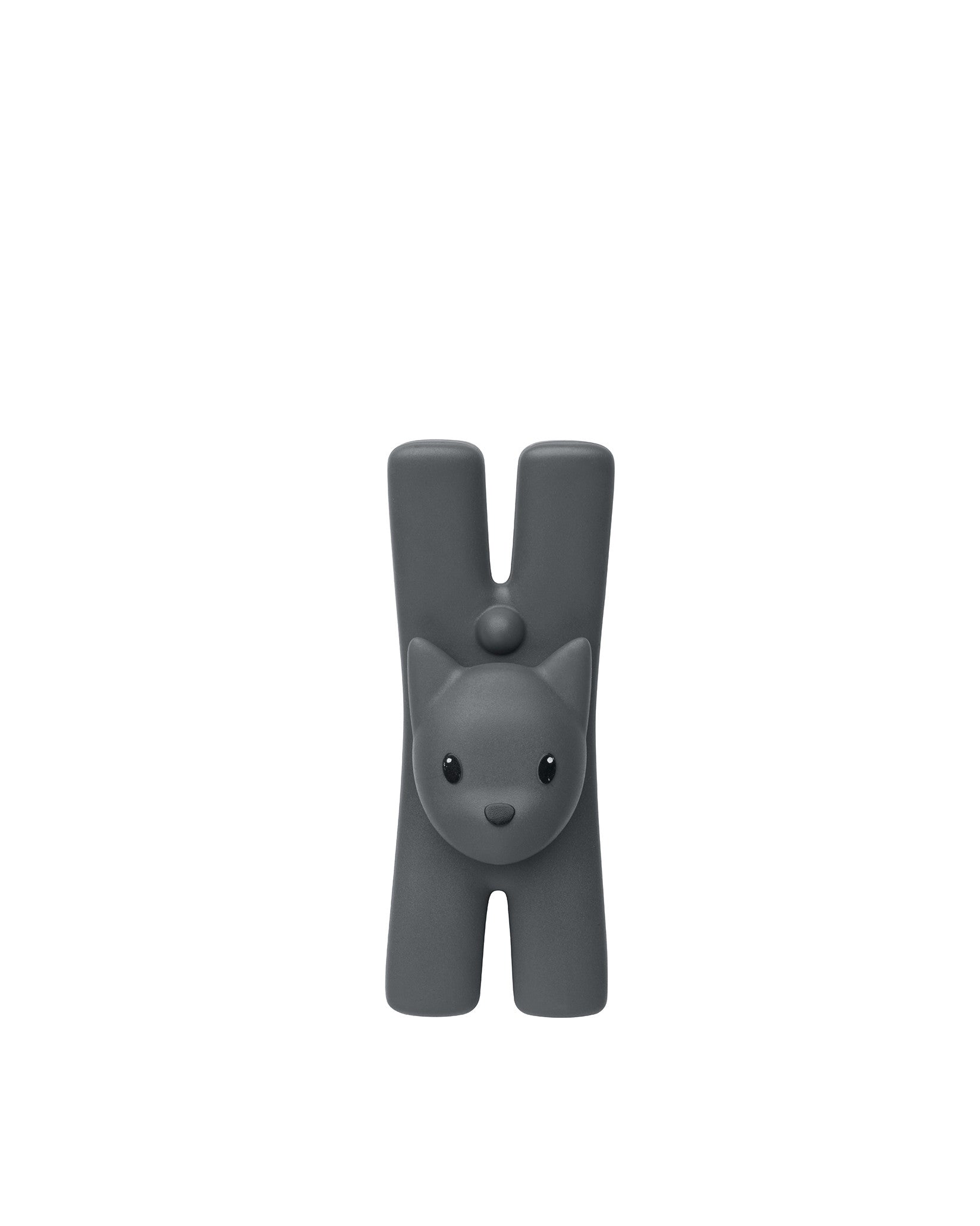 Dark grey cat-shaped decorative object by Alessi, with a minimalist design, small ears, and an H-shaped body.