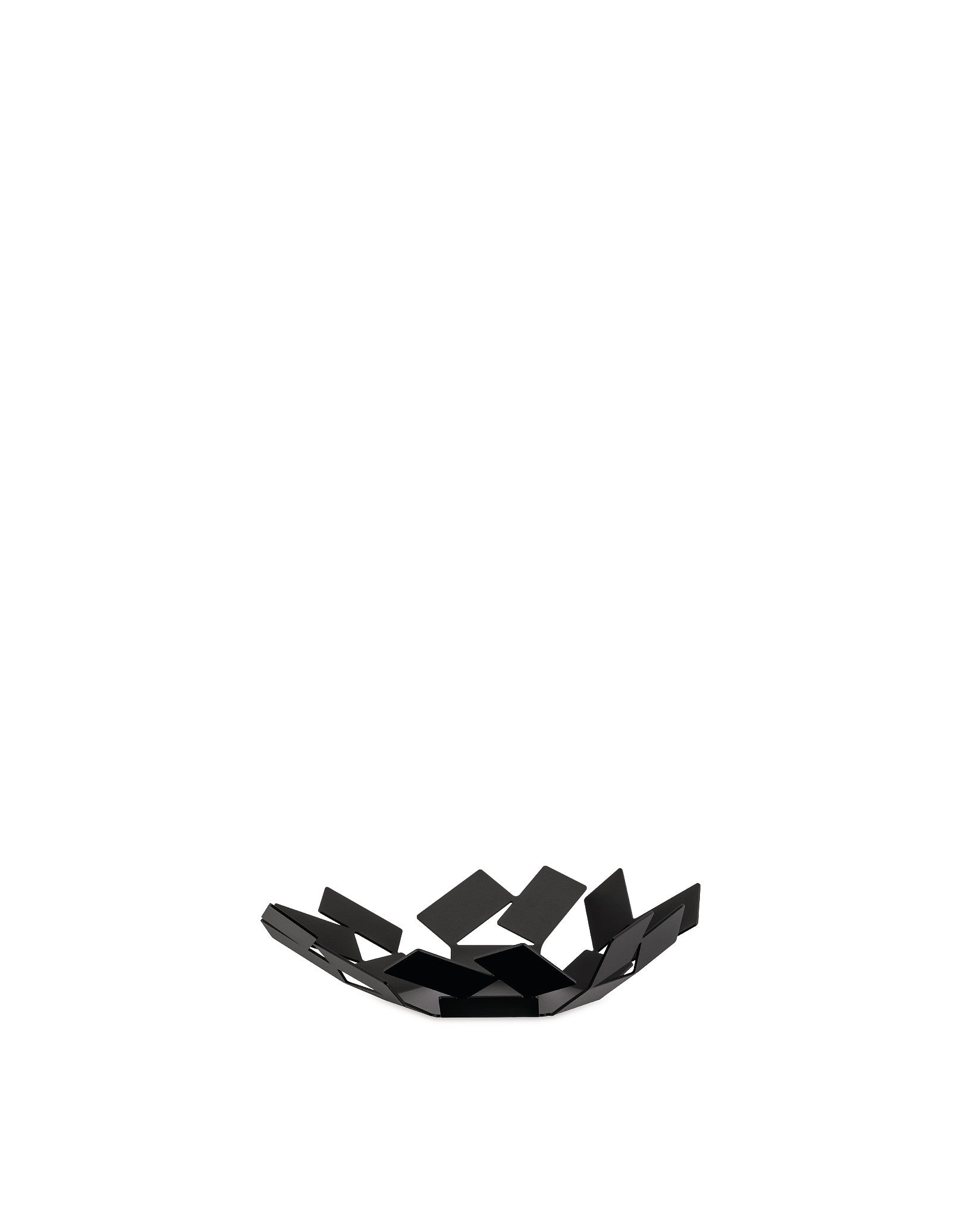 Black metal fruit bowl by Alessi, featuring an open, geometric design made from angular panels.