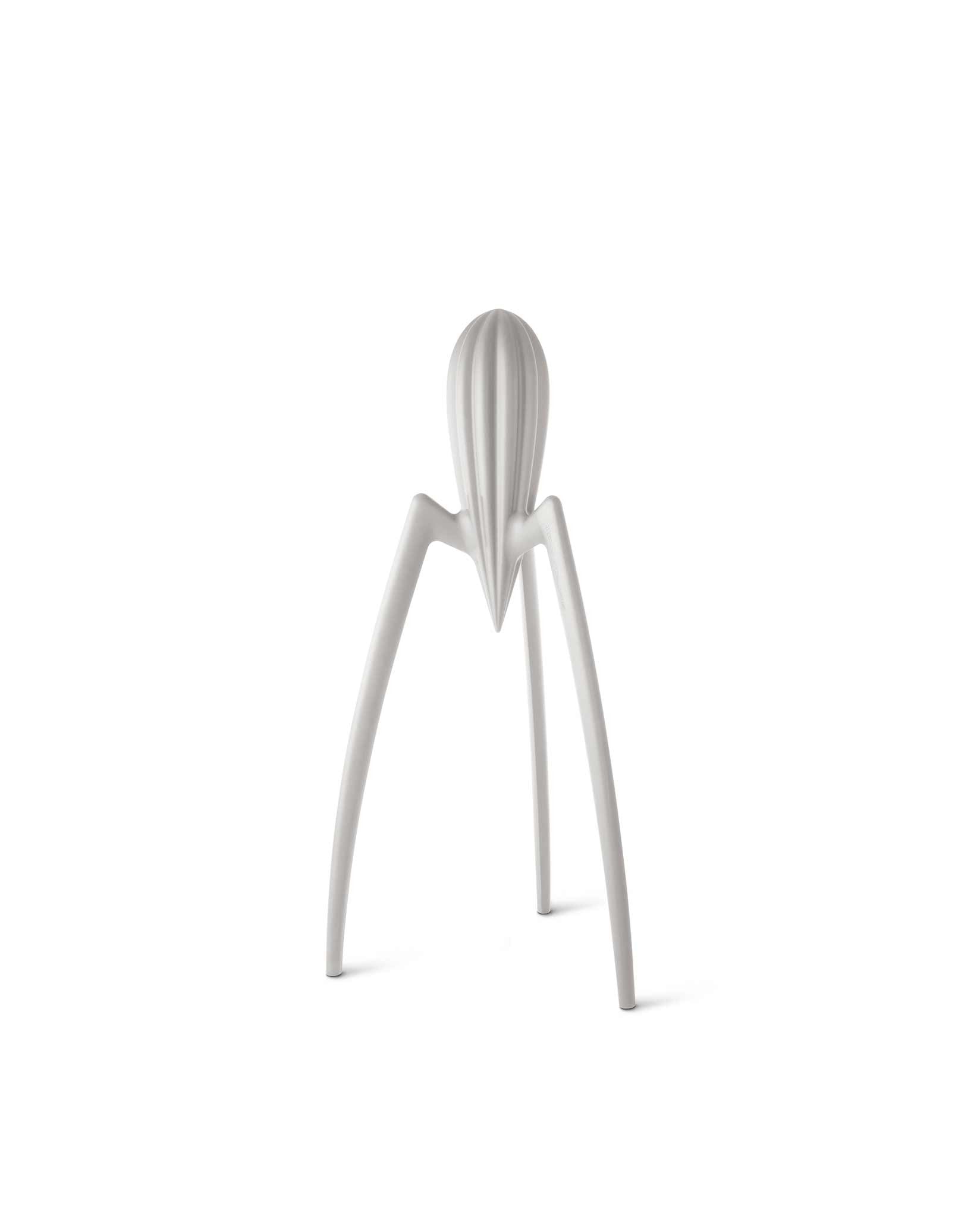 Silver-colored iconic juicer by Alessi, featuring a distinctive three-legged, spider-like design.