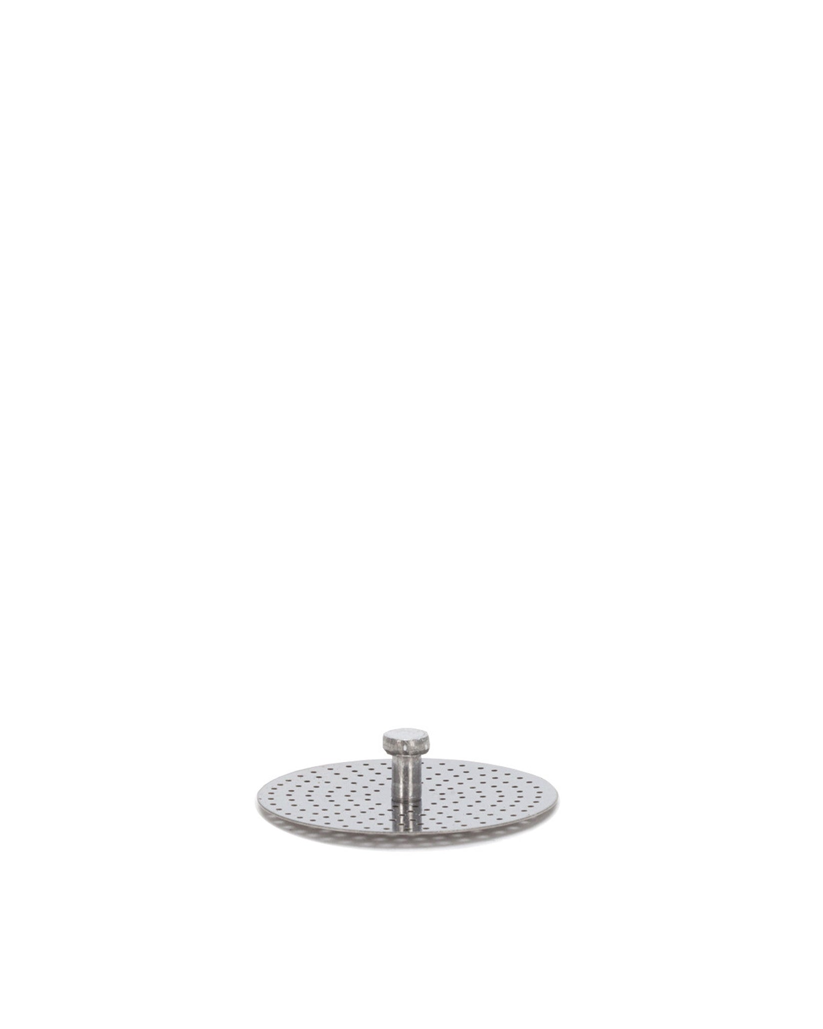 Silver-toned, round, perforated metal spare part by Alessi, featuring a central cylindrical screw.