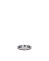 Perforated silver metal spare part by Alessi, with a raised rim and small holes, angled view.