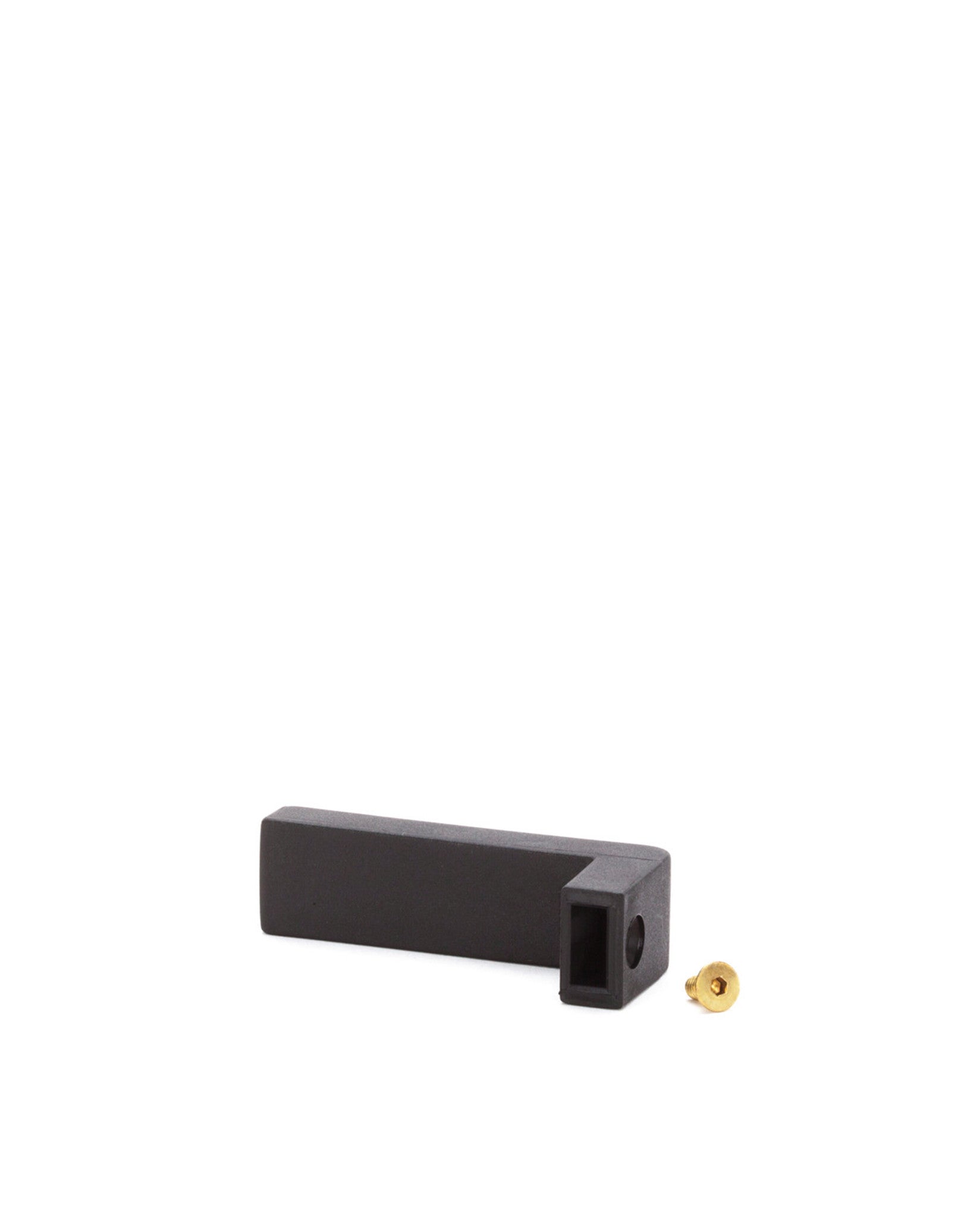 Black L-shaped plastic spare part by Alessi, with a side hole and a separate brass screw.