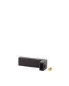 Black L-shaped spare part by Alessi, with a small brass screw.