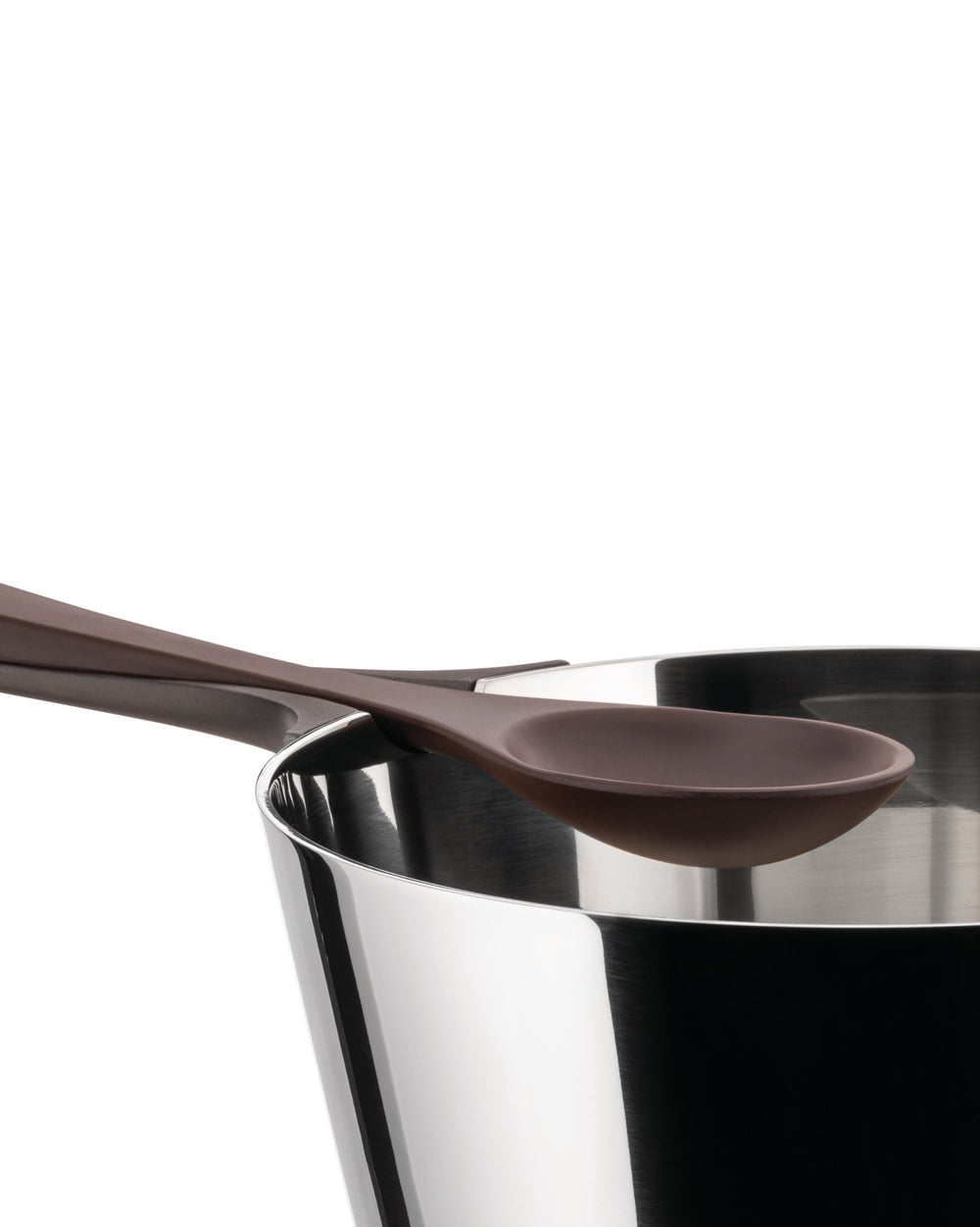 Sleek silver pasta pot by Alessi, with a brown spoon resting on its reflective rim.