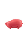 Red car-shaped lunchbox by Alessi, with small wheels and a smooth matte finish, side view.