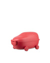 Red car-shaped food container by Alessi with four wheels and a front latch embossed with the brand name.