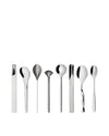 Eight polished silver metal spoons by Alessi, each featuring a unique and modern sculptural design.