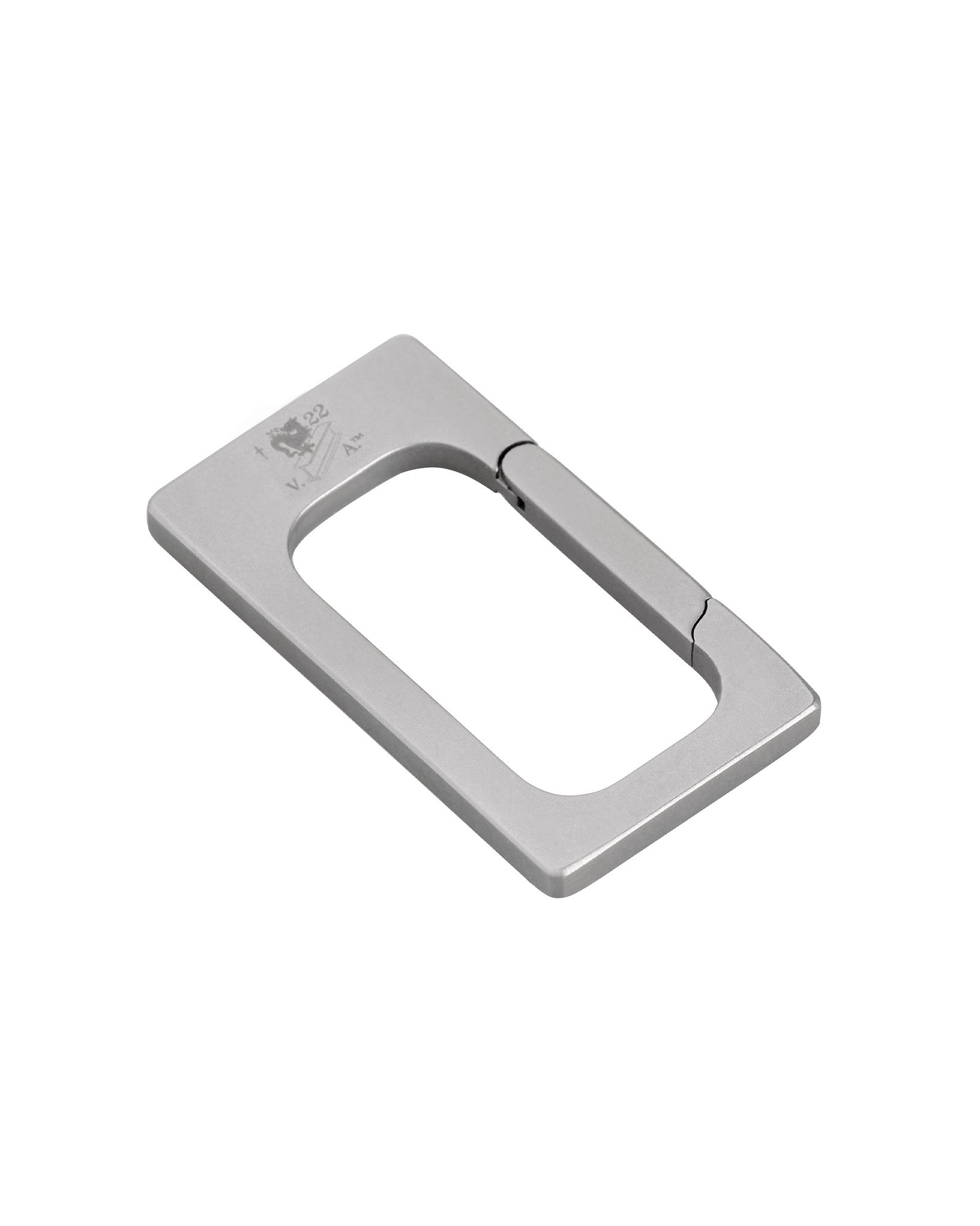 Silver rectangular metal utility clip by Alessi, with a spring-loaded gate and engraved logo, angled view.