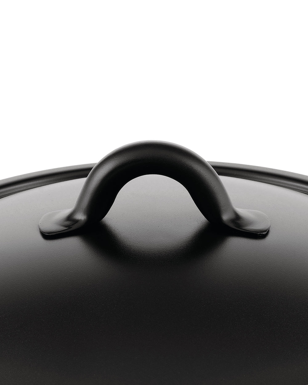 Black matte pot lid by Alessi with a curved handle and slightly textured surface, seen from a top-down view.