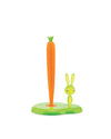 A green and orange paper towel holder by Alessi, featuring a tall carrot spindle and a small light green bunny on the base.
