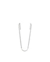 Silver metal tongs by Alessi with serrated gripping ends, standing upright.