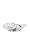 Silver metal fruit bowl by Alessi with a modern, sculptural wavy design, viewed from the side.