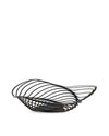 Black metal wire fruit bowl by Alessi with an undulating, sculptural design, presented on a white background.