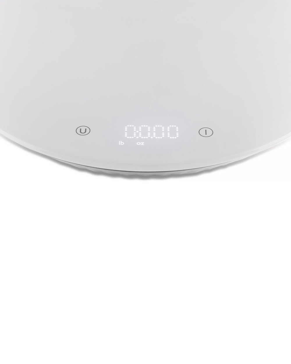 White digital kitchen scale by Alessi with '0.000' displayed, showing lb and oz units, and unit/power buttons.