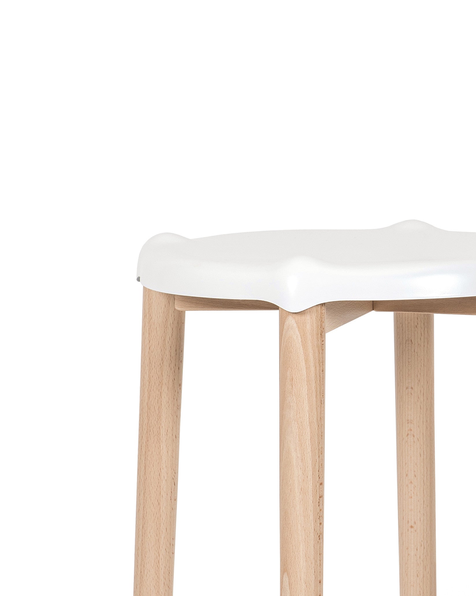 White stool with a contoured seat and light wooden legs by Alessi, close-up.