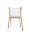 Modern white and wood chair by Alessi, with a curved backrest and visible 'ALESSI STARCK' text, shown from the back.