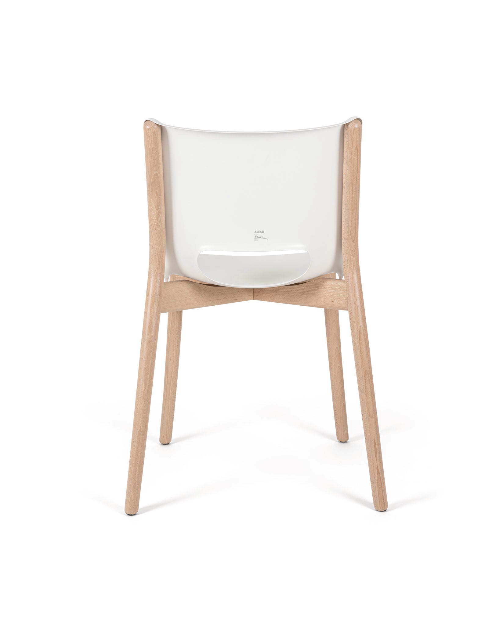 Modern white and wood chair by Alessi, with a curved backrest and visible 'ALESSI STARCK' text, shown from the back.