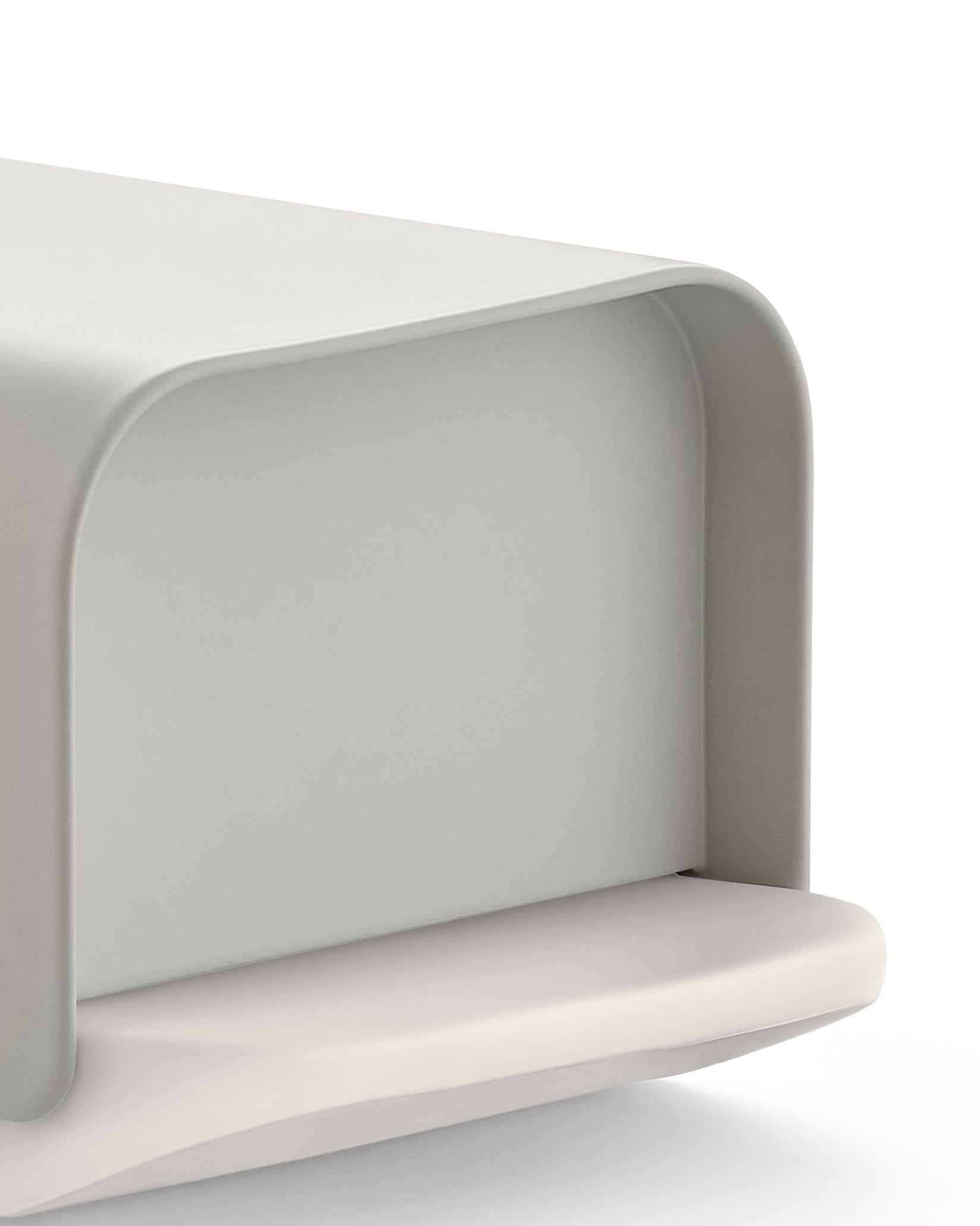 Light gray Mattina bread bin by Alessi, featuring a smooth matte finish and rounded edges, front right view.