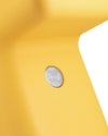Yellow Doraff by Alessi with a metallic oval plaque showing 'Doraff' and 'UNSTUDIO Ben van Berkel' on its textured surface.
